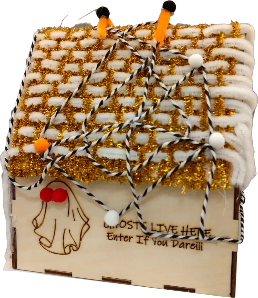 A haunted house engraved with a ghost and the words 'Ghosts live here — Enter if you dare!'